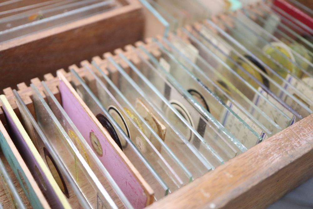 A Negretti and Zambra cased brass microscope and various specimen slides